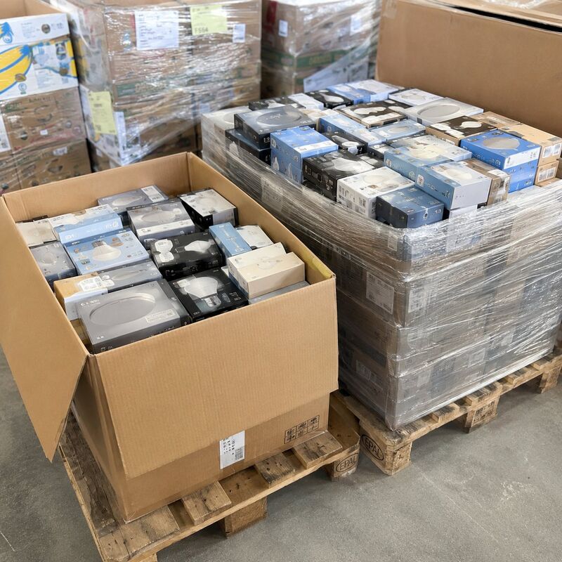 Boxed LED lighting products in an open box on a pallet